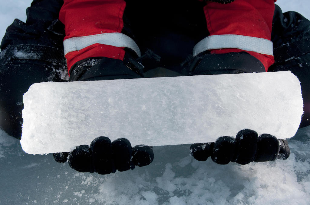 A scientist holds an ice core recently drilled from the Arctic Ocean icepack.