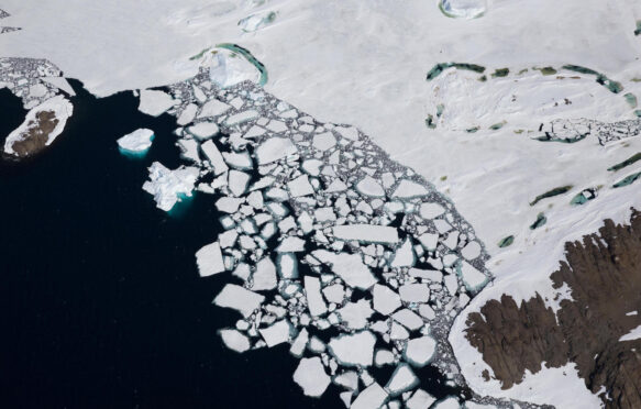 Floating ice breaking away from Holl Island, Antarctica.