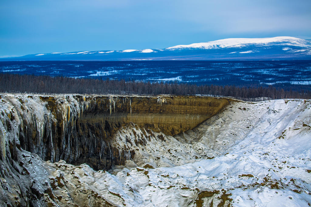 A huge thermokarst crater showing the damage to the permafrost and our climate, Batagay, Russia.
