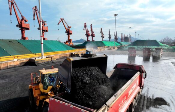 Transport vehicles transfer coal a terminal in Jiangsu, China.