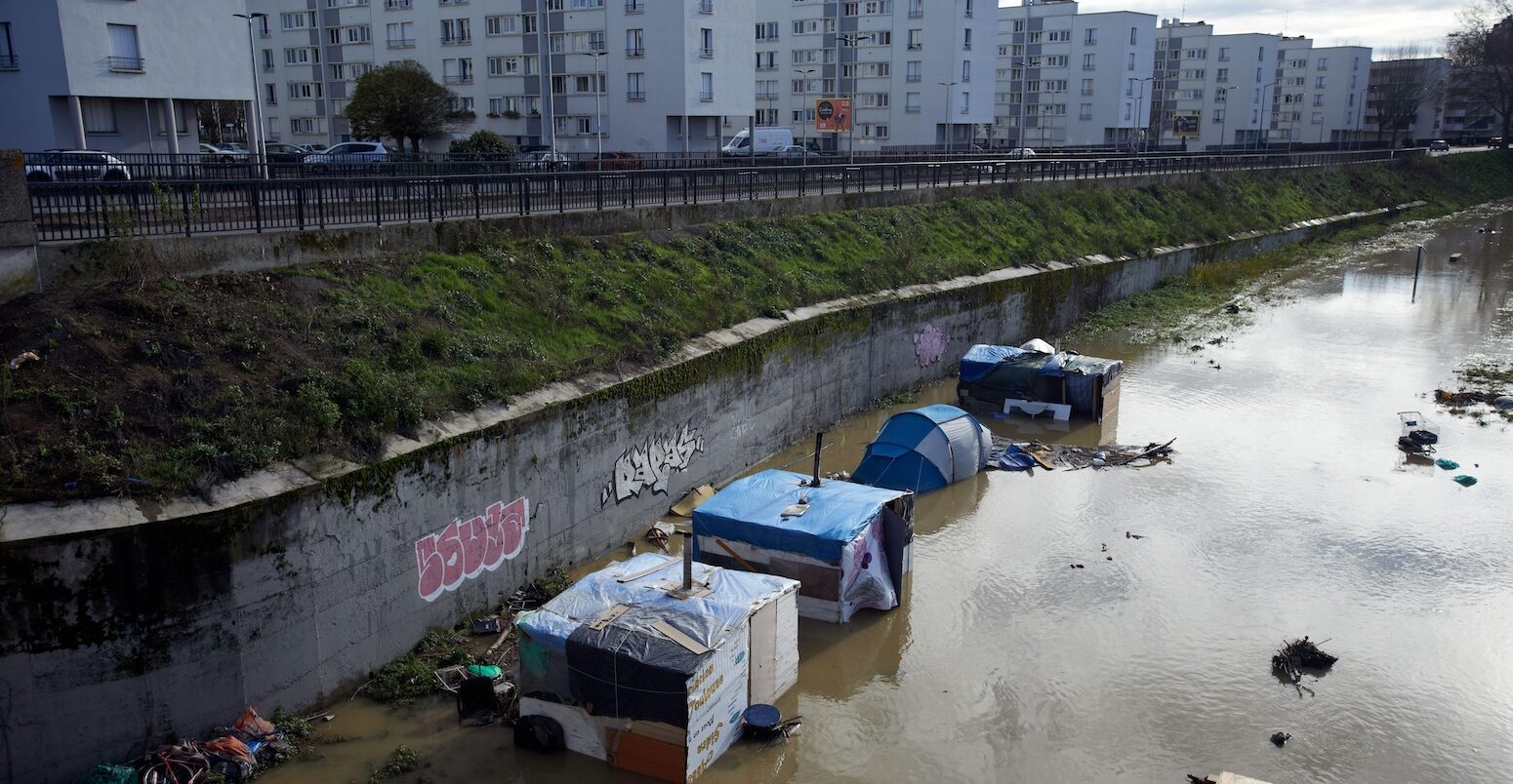Flooded slums on the Garonne river banks