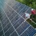 Aerial view of technicians installing solar panels.