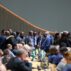 Delegates huddle at COP29 in Baku.