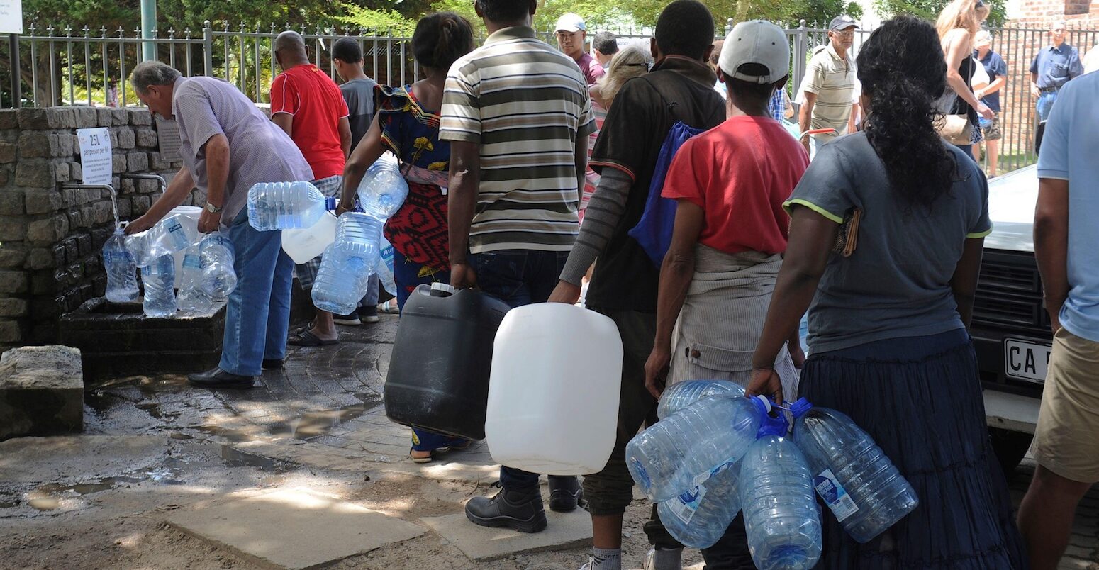 Residents queue for water at a natural spring in Cape Town, South Africa.