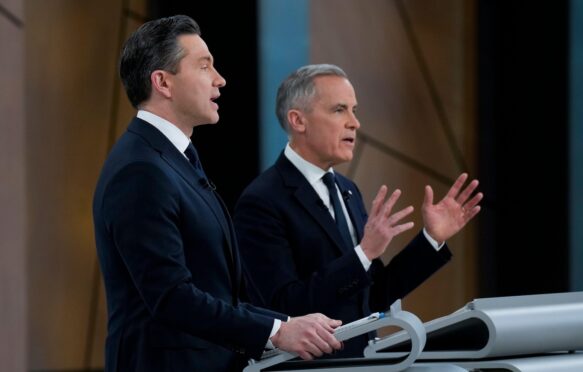 Canadian conservative leader Pierre Poilievre (L) and liberal leader Mark Carney (R) during the English-language federal leaders' debate ahead of Canada's federal election.