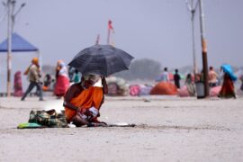 People brave heat wave conditions during a hot summer day in Uttar Pradesh, India.