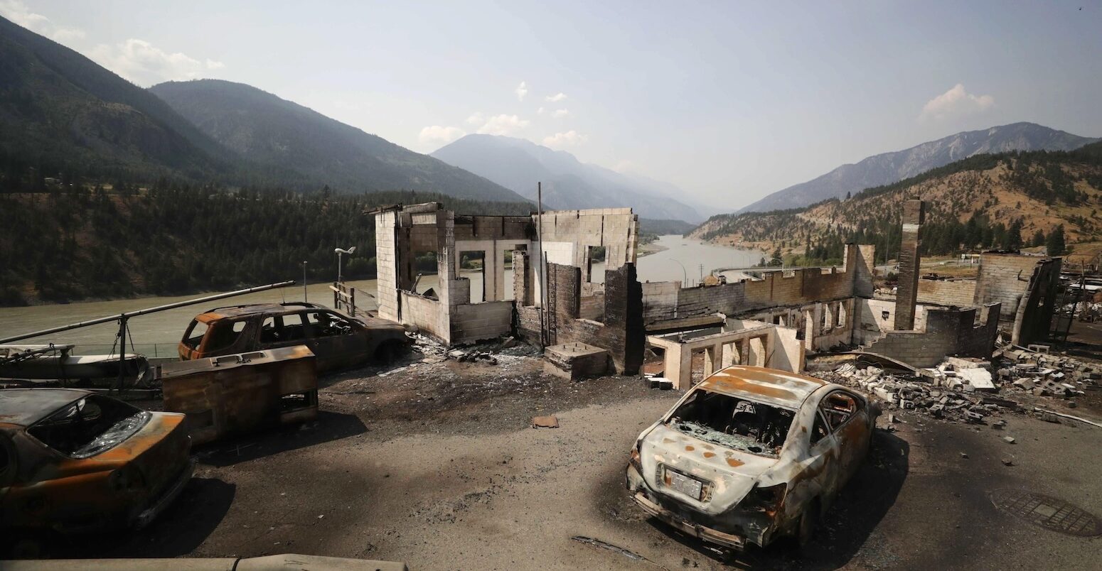 Damaged structures and vehicles after a wildfire destroyed most of the village, Lytton, B.C., Canada.