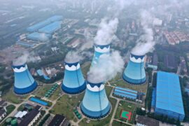 Cooling towers at a coal-fired power station in Nanjing, Jiangsu province, China. Credit: Associated Press / Alamy Stock Photo. Image ID: 2NMJBJ1.