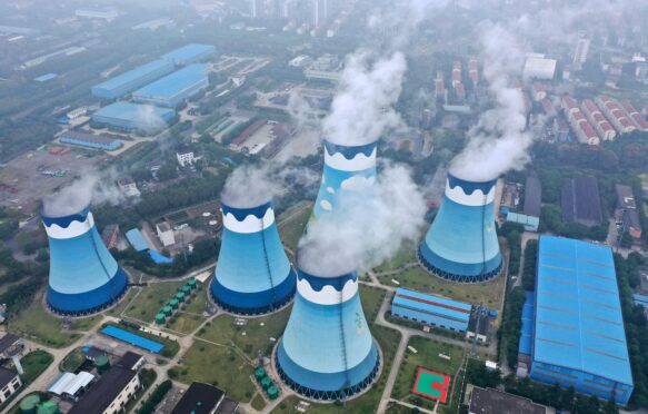Cooling towers at a coal-fired power station in Nanjing, Jiangsu province, China. Credit: Associated Press / Alamy Stock Photo. Image ID: 2NMJBJ1.