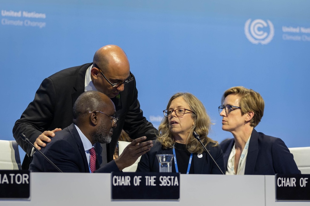 UNFCCC Executive Secretary Simon Stiell speaks with Adonia Ayebare, SBSTA Chair, and Julia Gardiner, SBI