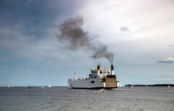 Ship emitting exhaust fumes.