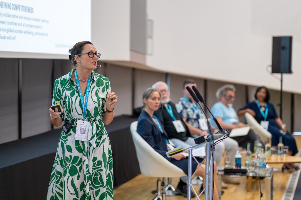 Sandrine Dixson-Decleve speaking at a plenary session on governance.