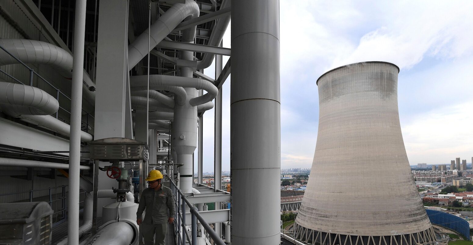 A worker inspects facilites at a coal-fired power plant in Wuhan, central China.