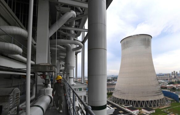 A worker inspects facilites at a coal-fired power plant in Wuhan, central China.