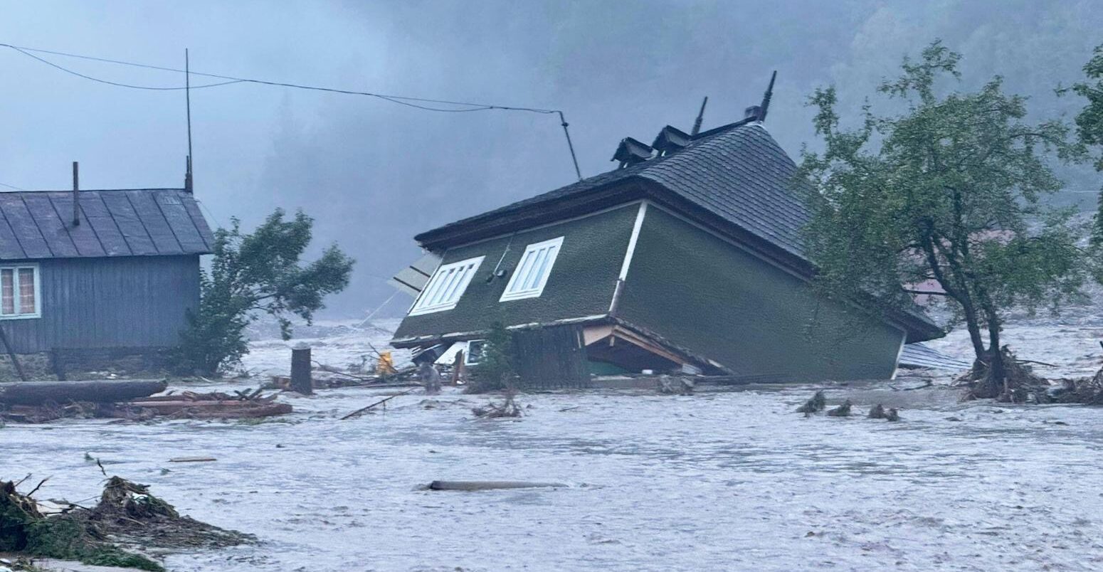 A house damaged after a flash flood in the village of Brosteni, Romania, 28 July 2025. Credit: Associated Press.