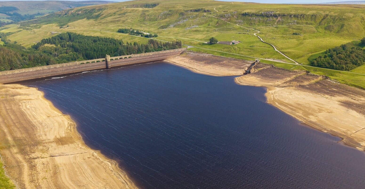 Drone photograph showing the very low water levels in Scar House Reservoir during the 2025 heatwave and drought.
