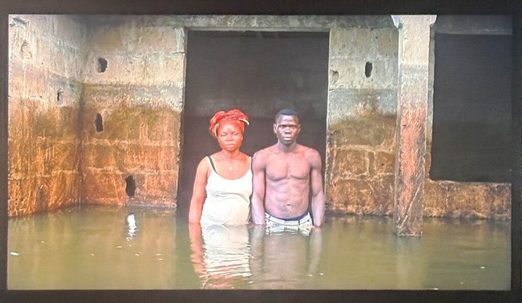 Mendel’s installation captures flood victims' “dignity and resilience” as they stand in the liquid landscape. Credit: Svetlana Onye