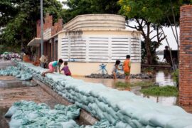 Stacked sandbags on the bank of the Mekong River to prevent flooding, Cambodia.