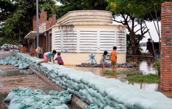 Stacked sandbags on the bank of the Mekong River to prevent flooding, Cambodia.