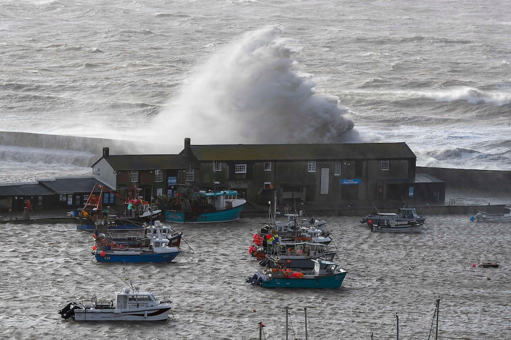 Stormy seas whipped up by gale force winds from Storm Eunice at Lyme Regis in Dorset.