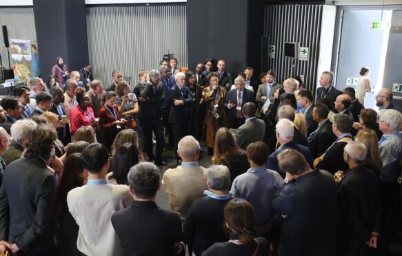 Delegates huddle to discuss the methodology report on CDR and CCUS at IPCC-63.