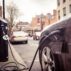 Electric car charging on London street.