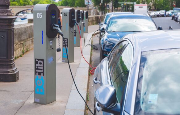 Charging stations for electric vehicles in Paris, France. Credit: Photononstop. Image ID: 2Y6MHE0