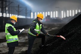 Workers check coal quality at the Buertai coal mine in Inner Mongolia, China.
