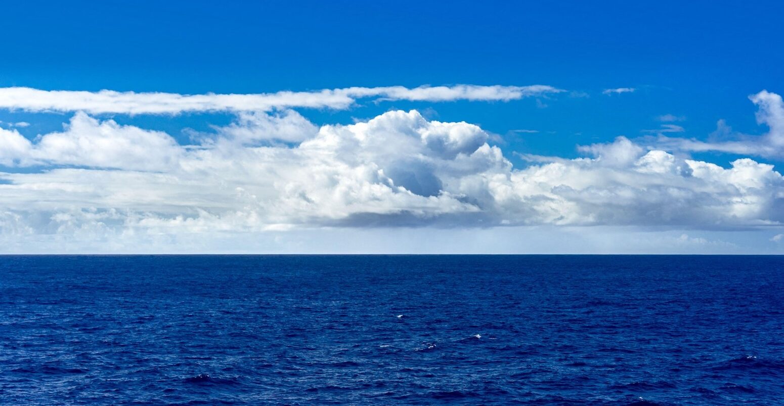 Cumulus clouds over the ocean. Credit: Felipe Sanchez / Alamy Stock Photo. Image ID: 3A1MRC5.