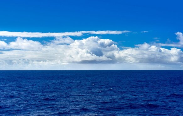 Cumulus clouds over the ocean. Credit: Felipe Sanchez / Alamy Stock Photo. Image ID: 3A1MRC5.