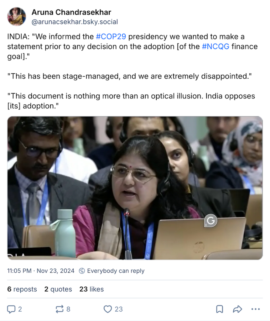 Bluesky post by Aruna Chandrasekhar, handle @arunacsekhar.bsky.social. Bluesky post says: INDIA: "We informed the #COP29 presidency we wanted to make a statement prior to any decision on the adoption lof the #NCQG finance goal]." "This has been stage-managed, and we are extremely disappointed." "This document is nothing more than an optical illusion. India opposes [its] adoption." There is a photo attached of a woman speaking at COP29.