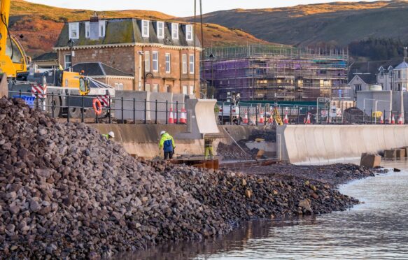 Firth of Clyde seawall repair using precast concrete sections on Largs Promenade, Ayrshire, Scotland UK.