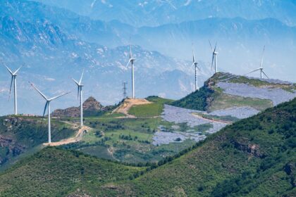 Solar panels and wind turbines on the hills outside Beijing, China.