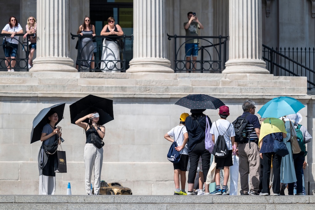 Tourists sheltering from high temperatures in London on 11 August 2025.