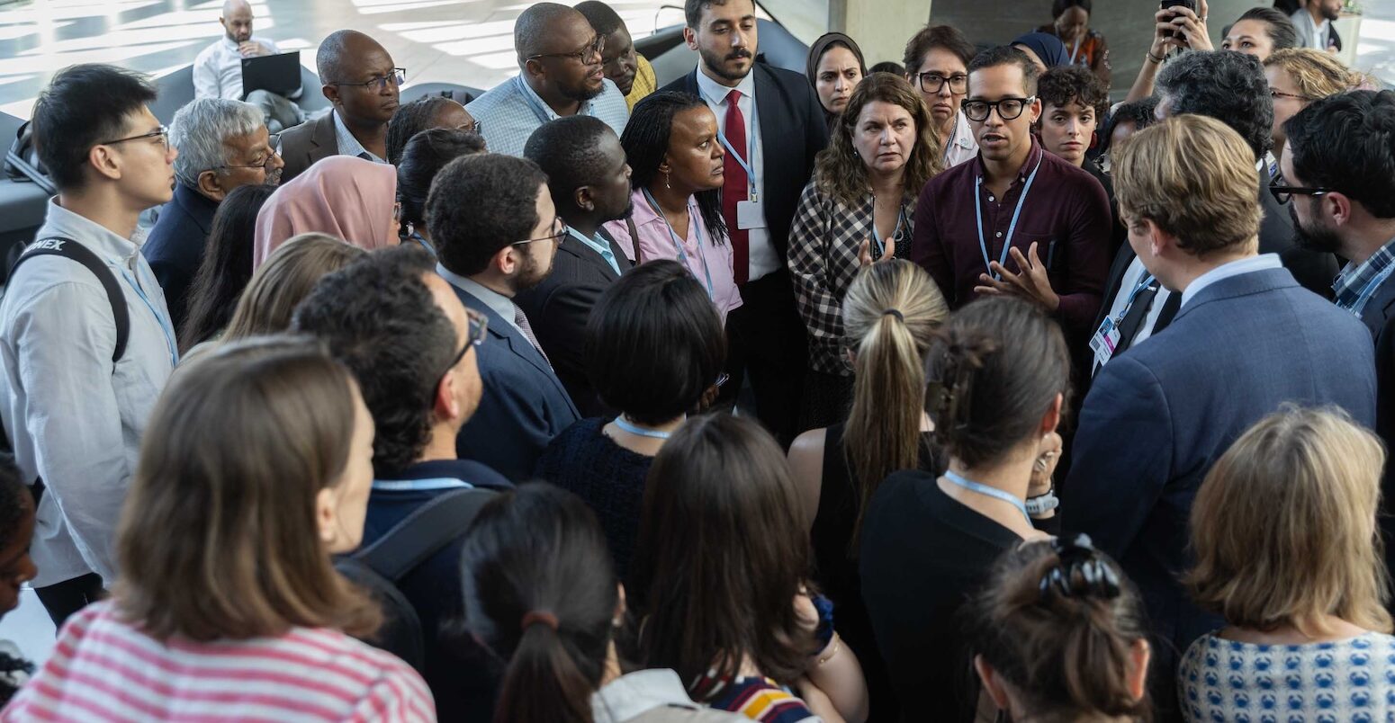 Delegates huddle in Bonn on 18 June 2026