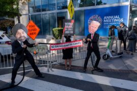 Global climate and development activists stage a vivid "Tug-of-War for the Planet," between World Bank President Ajay Banga and U.S. President Donald Trump.