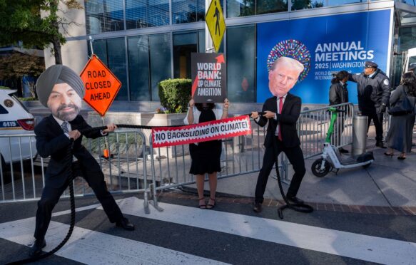 Global climate and development activists stage a vivid "Tug-of-War for the Planet," between World Bank President Ajay Banga and U.S. President Donald Trump.