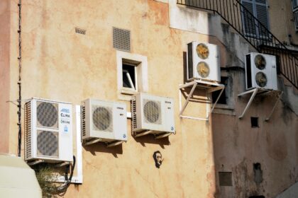 Air conditioners on the wall of a house in Corsica, France.
