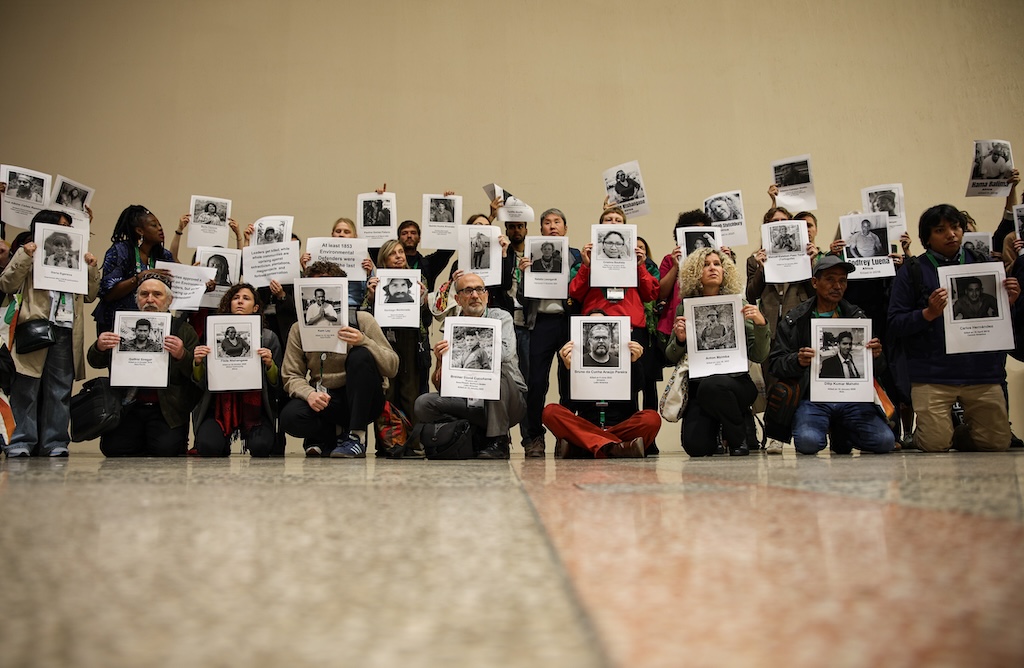 Protest in the COP17 corridors drawing attention to the killings of environmental defenders.